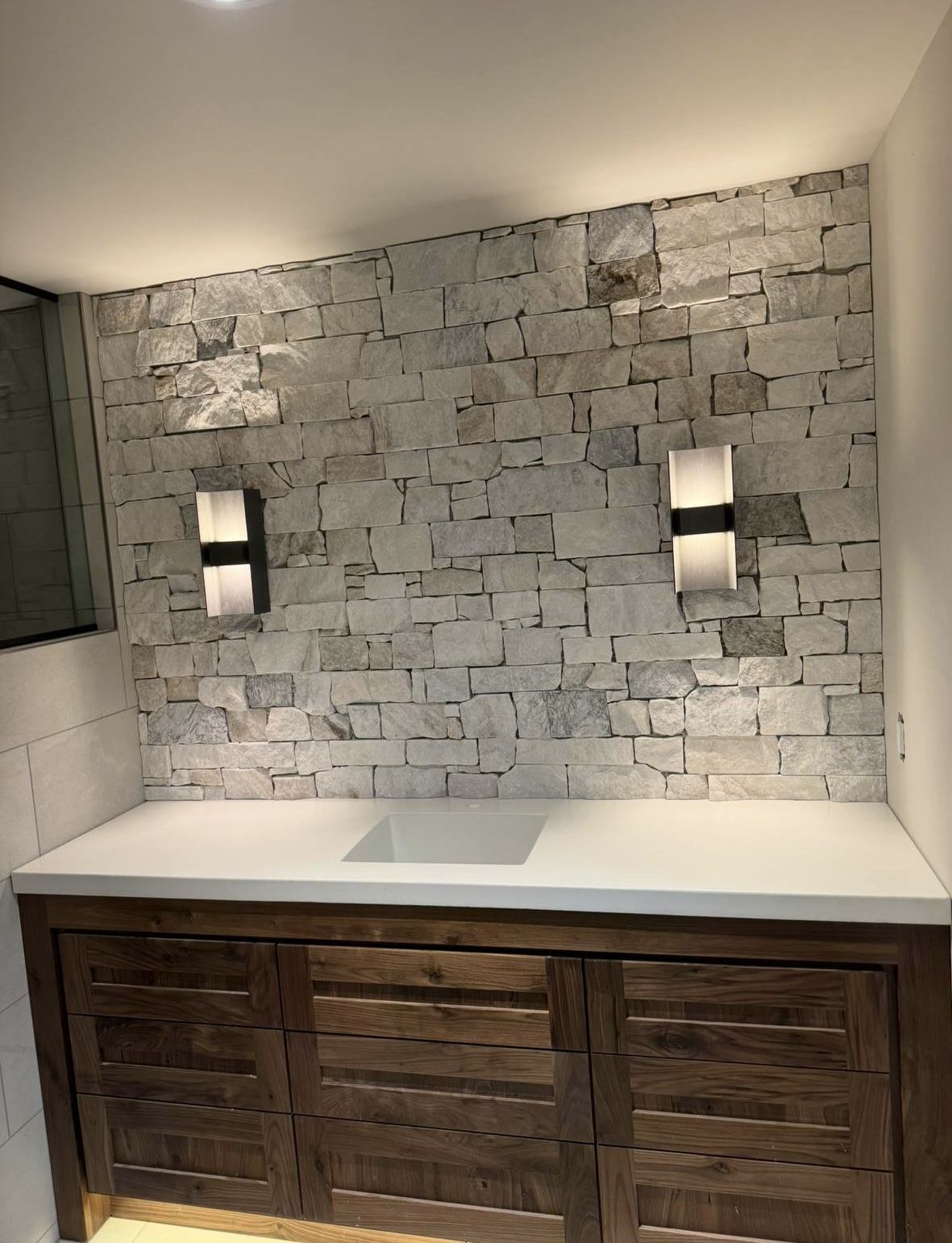 Vanity remodel — natural stone accent wall
